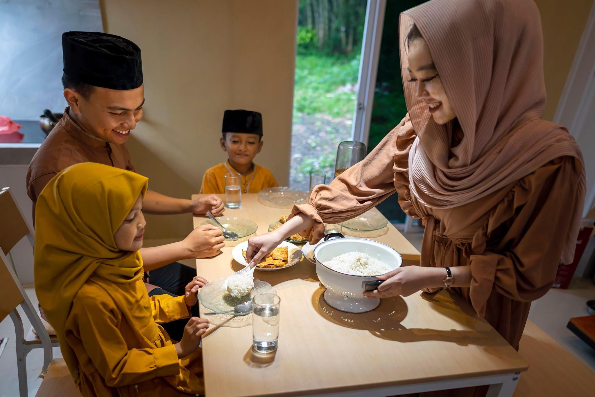 Indonesian Muslim family sharing a halal meal together